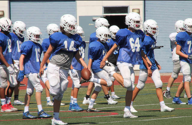 Frosh Dons Hit the Football Field in Scrimmage
