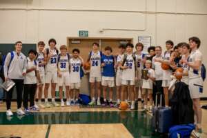 VARSITY BOYS HOOPS MOUNTS FURIOUS COMEBACK TO TAKE THIRD AT SURF N' SLAM