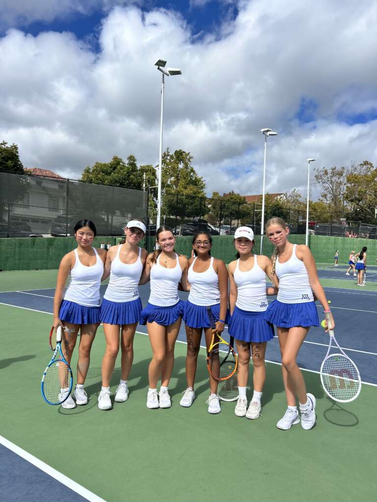 Some of the freshmen pose after their warmup.